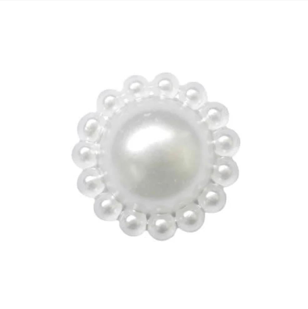 White flower-shaped pearlised polyester sewing button with a scalloped edge.