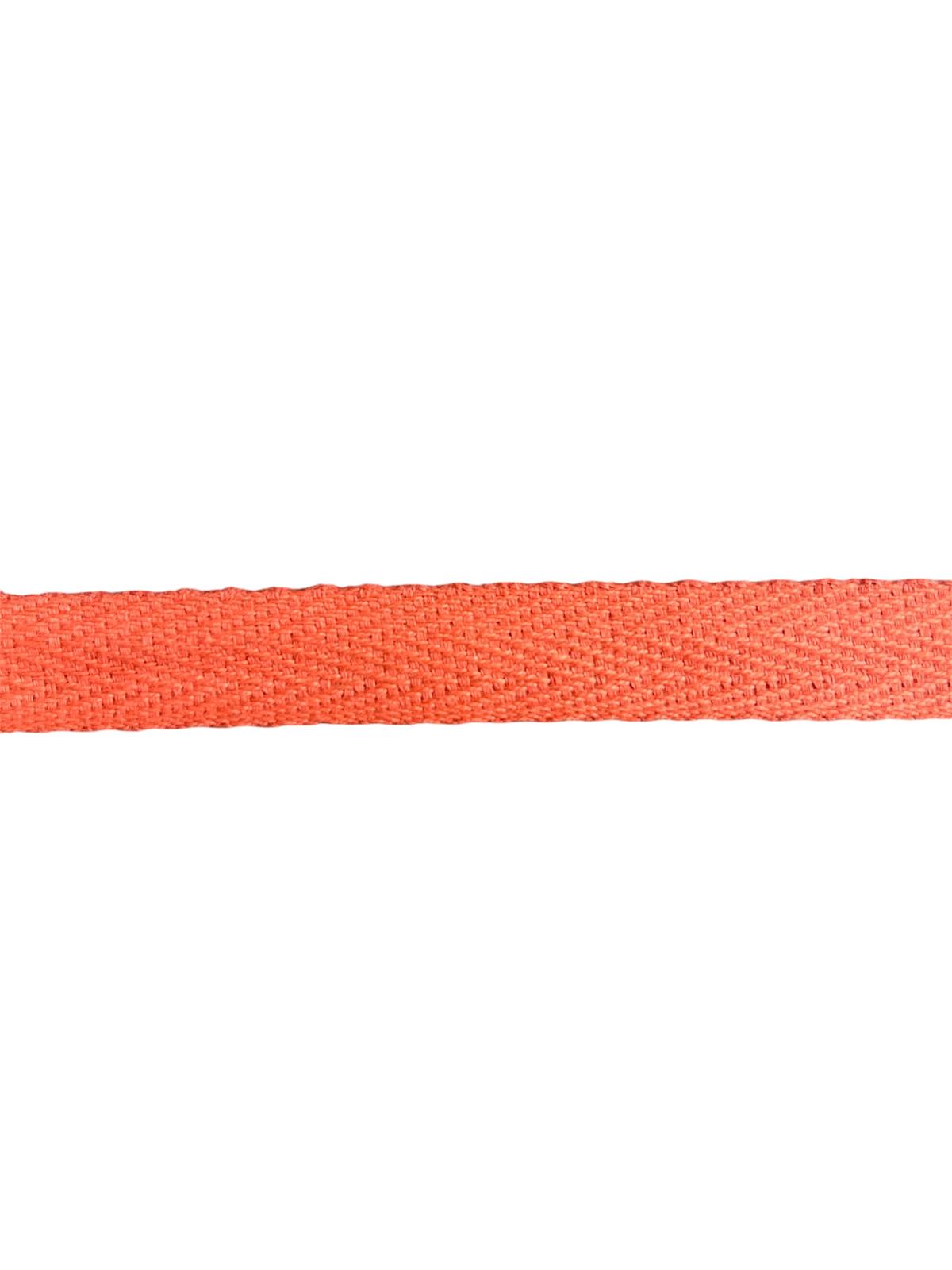 A close-up of 15mm orange herringbone cotton twill webbing tape for sewing.