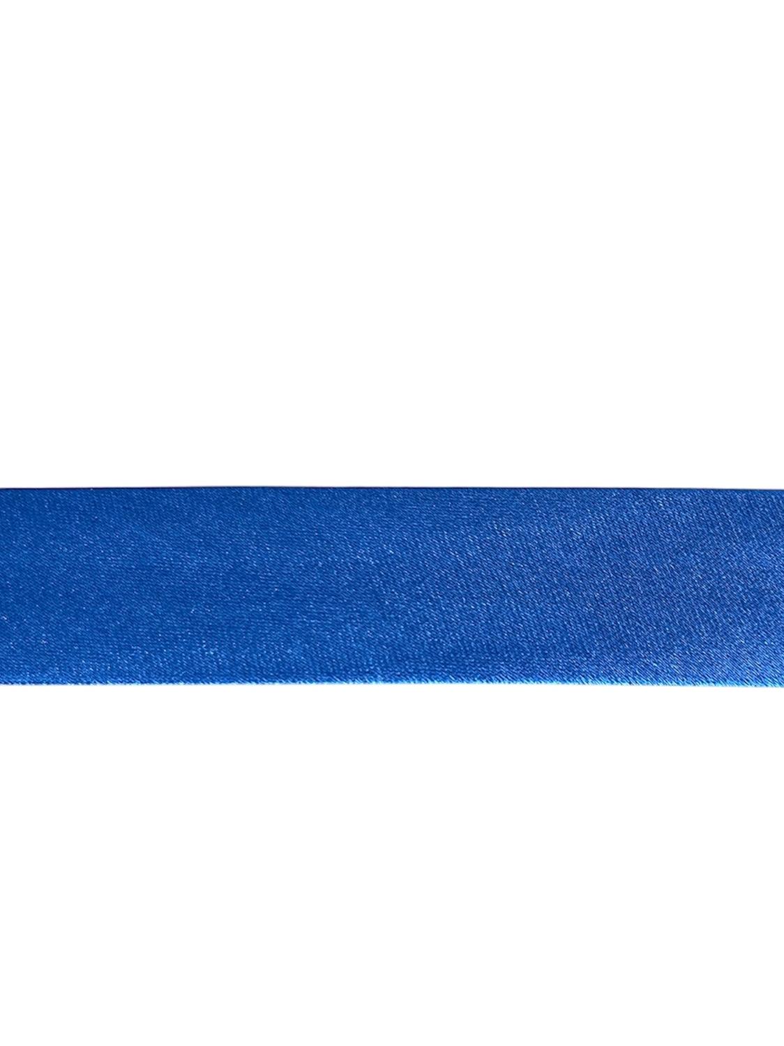 A close-up of a single strip of royal blue satin bias binding tape.