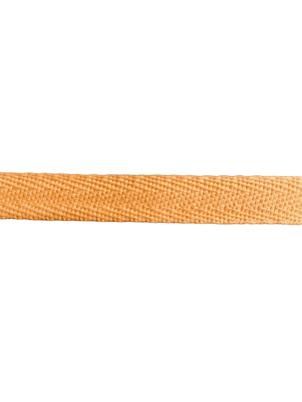 A close-up of 15mm orange herringbone cotton twill webbing tape for sewing.