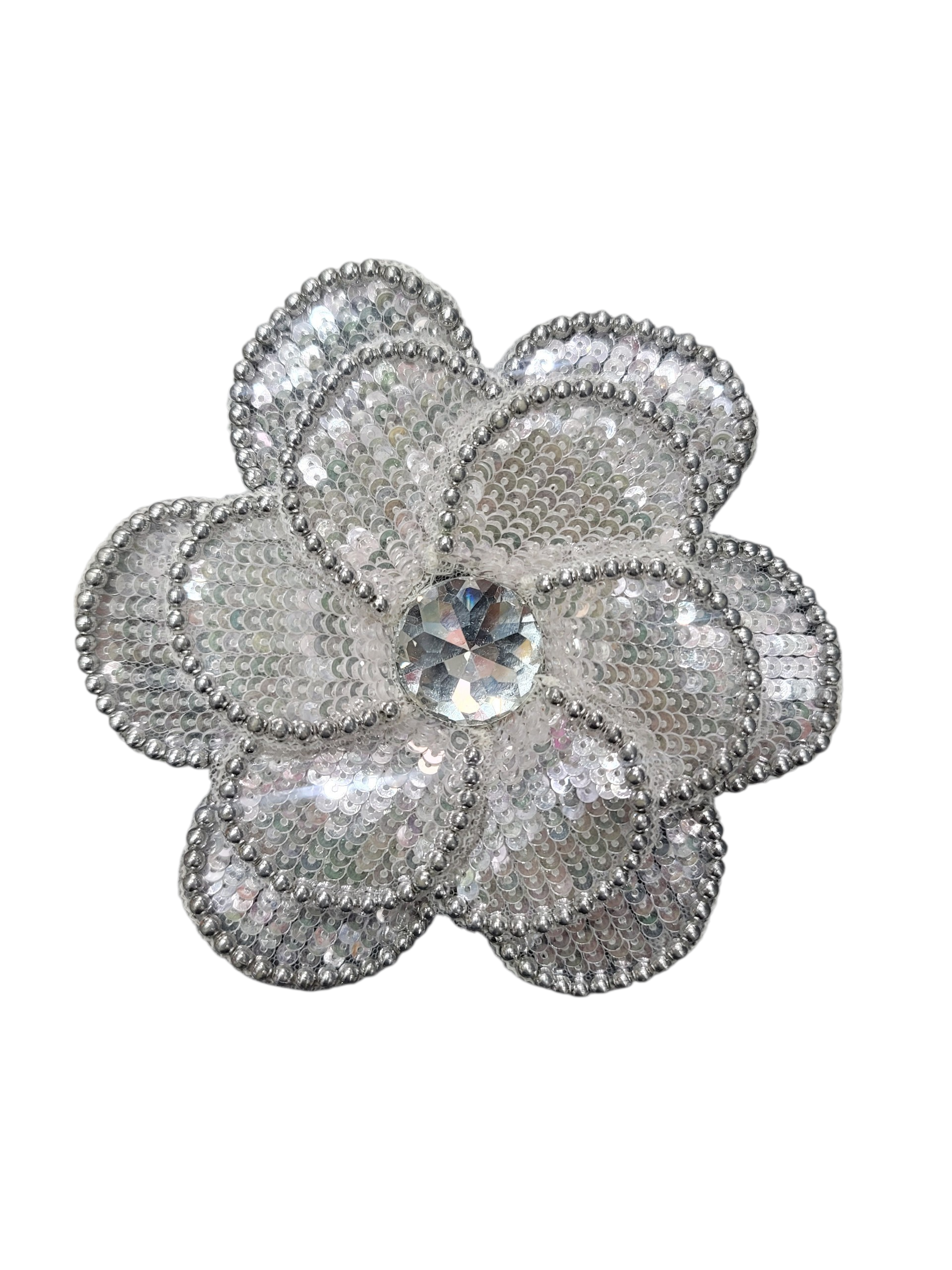 Hand embroidered flower accessory featuring silver beads, ivory sequins, and a central clear gem.