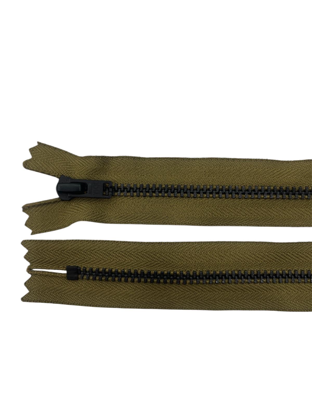 Two olive green zippers with black metal teeth and sliders on a white background.