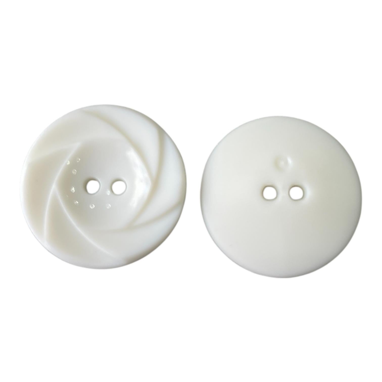 White 28mm polyester button featuring a decorative swirl pattern on the front and a smooth back.