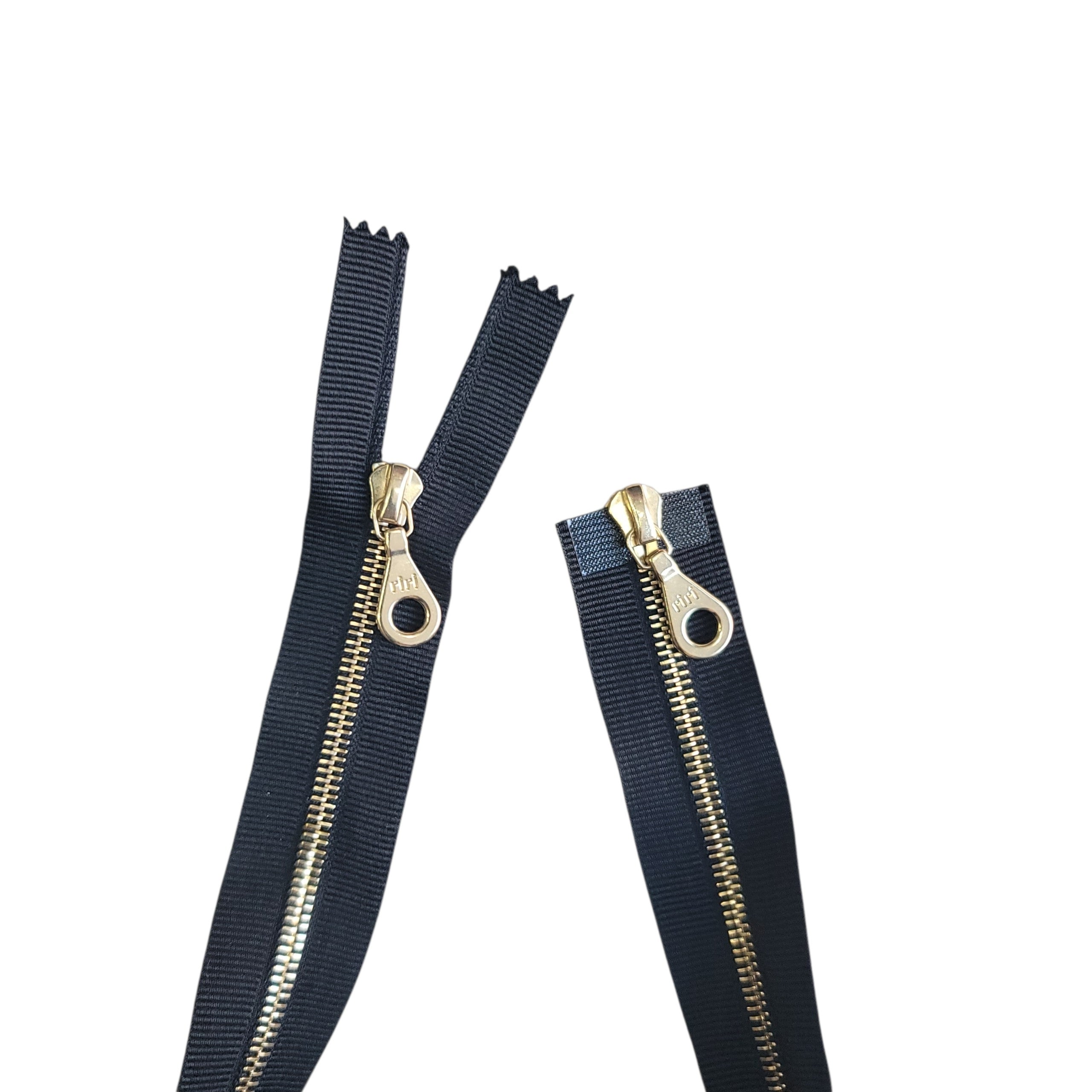 Riri M4 gold metal two-way open zip with black tape and circular pulls.