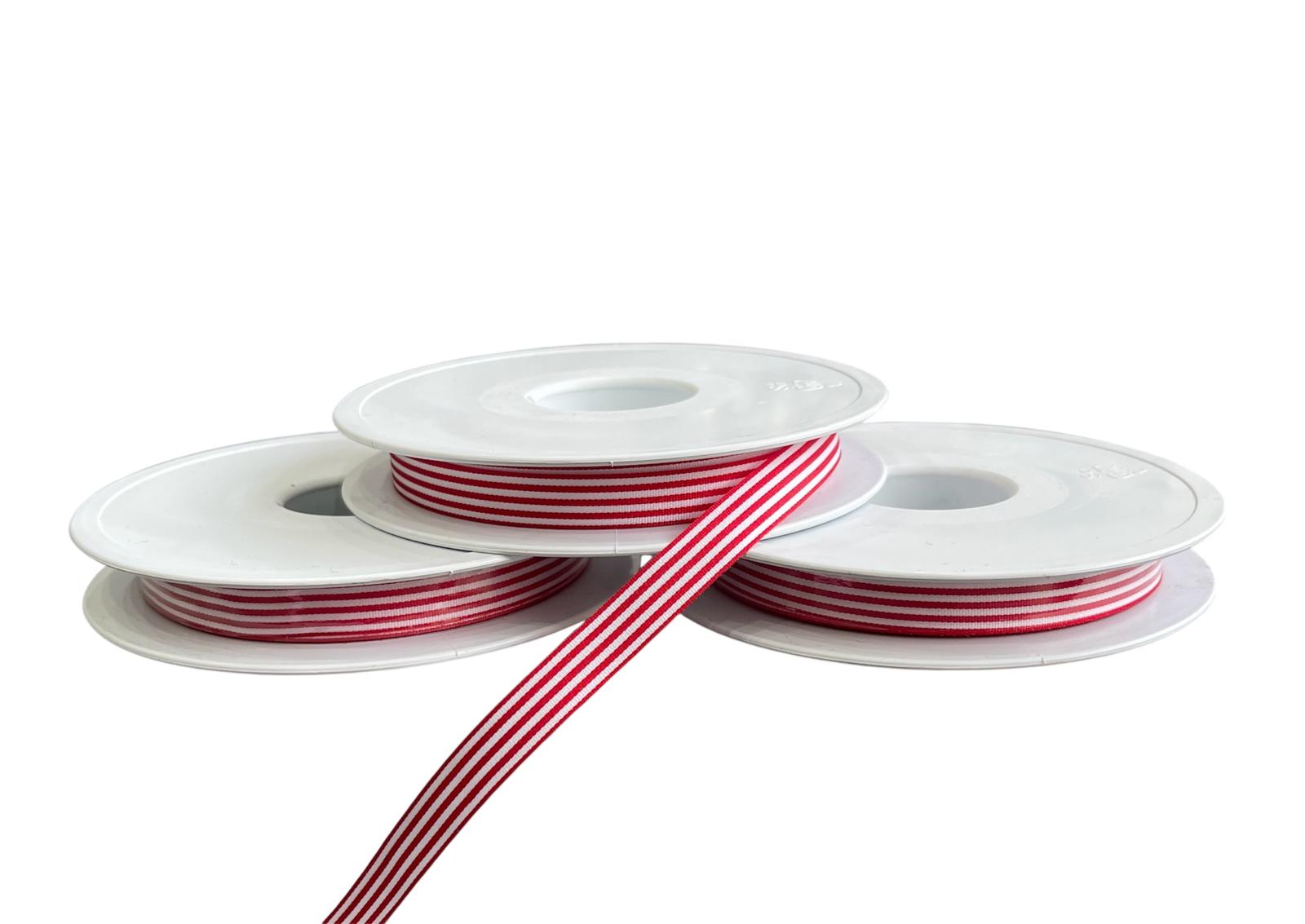 Three rolls of 10mm red and white striped polyester ribbon on white spools.