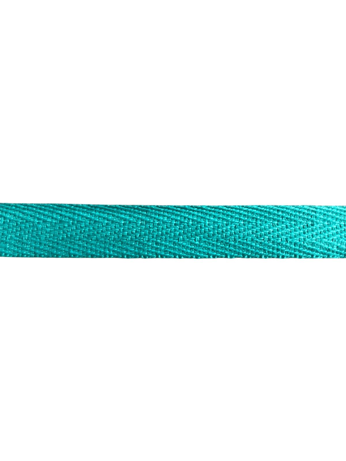 A close-up of 15mm teal cotton herringbone tape with a distinct twill weave pattern.
