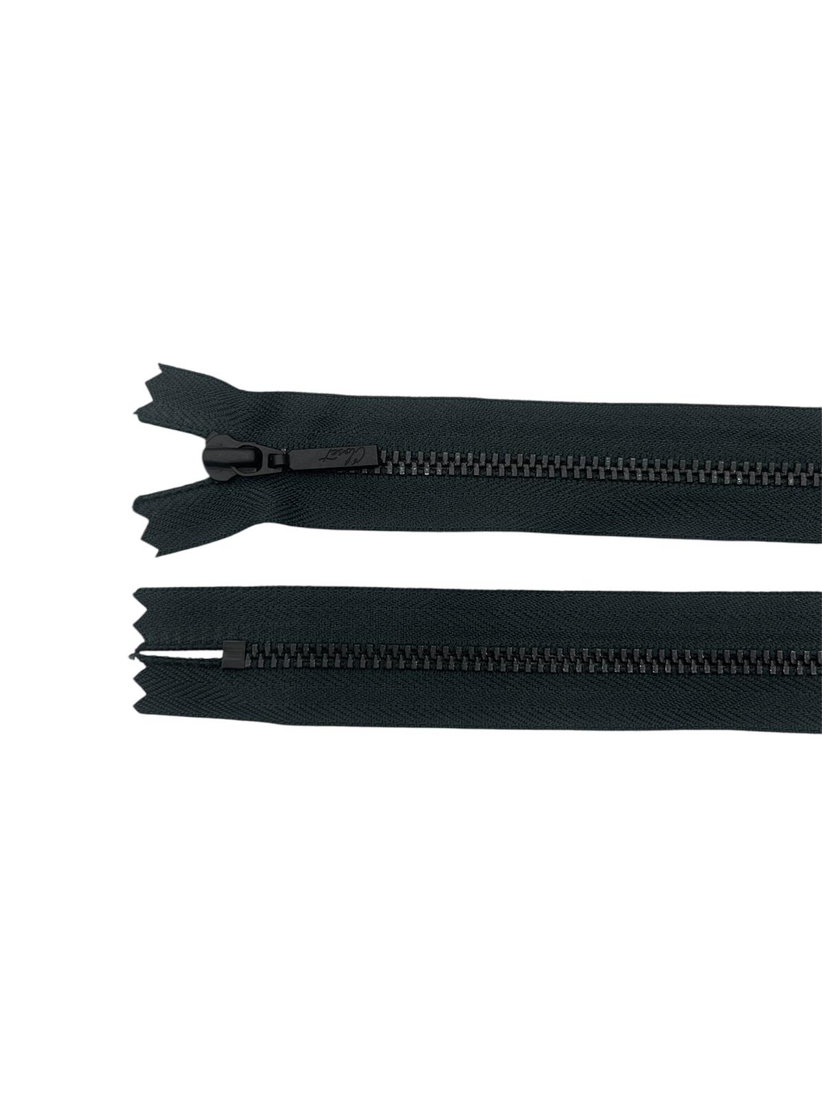 YKK black metal closed-end zipper with visible teeth and slider.