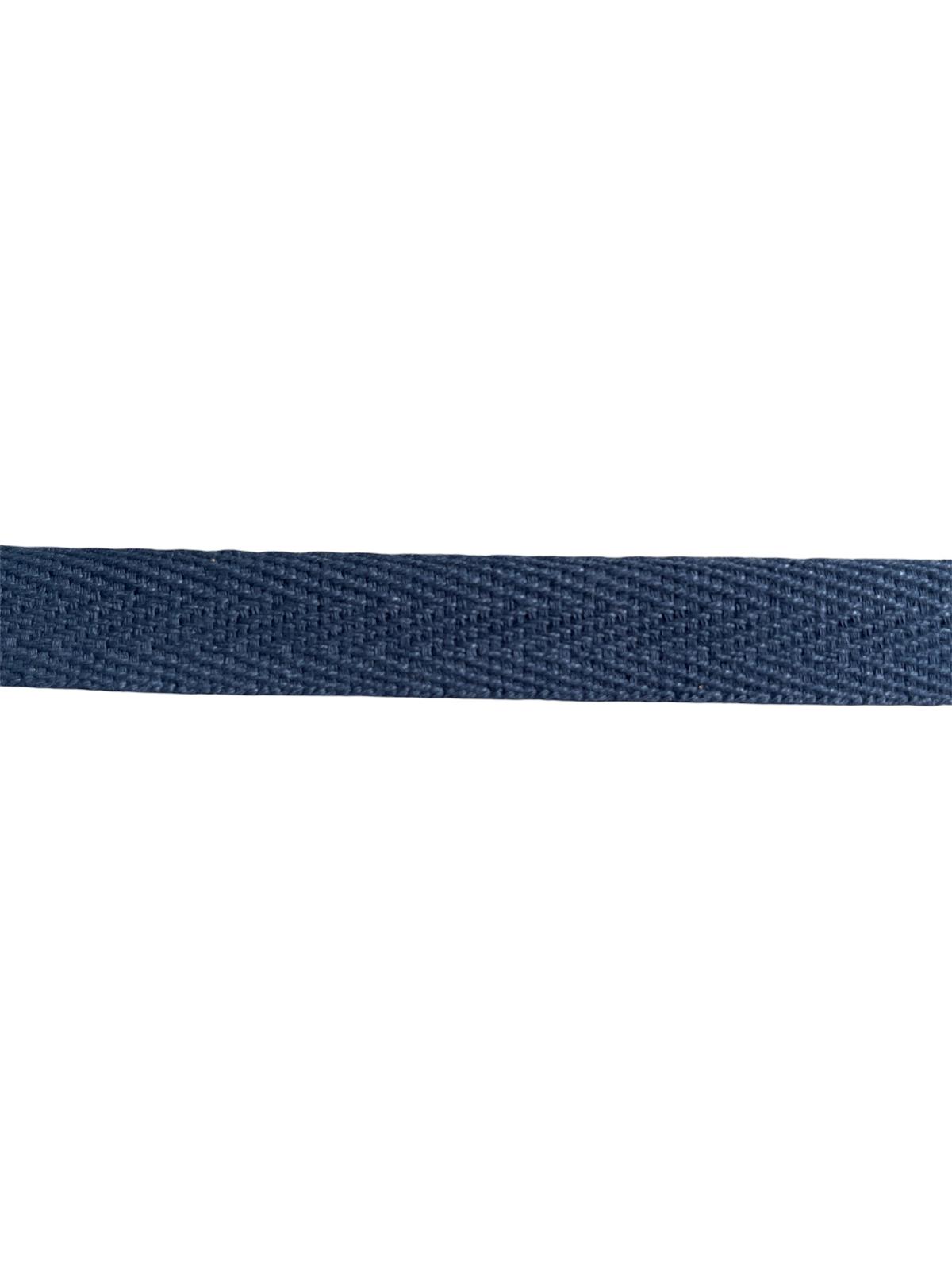 A close-up of 15mm navy blue herringbone cotton twill webbing tape for sewing.