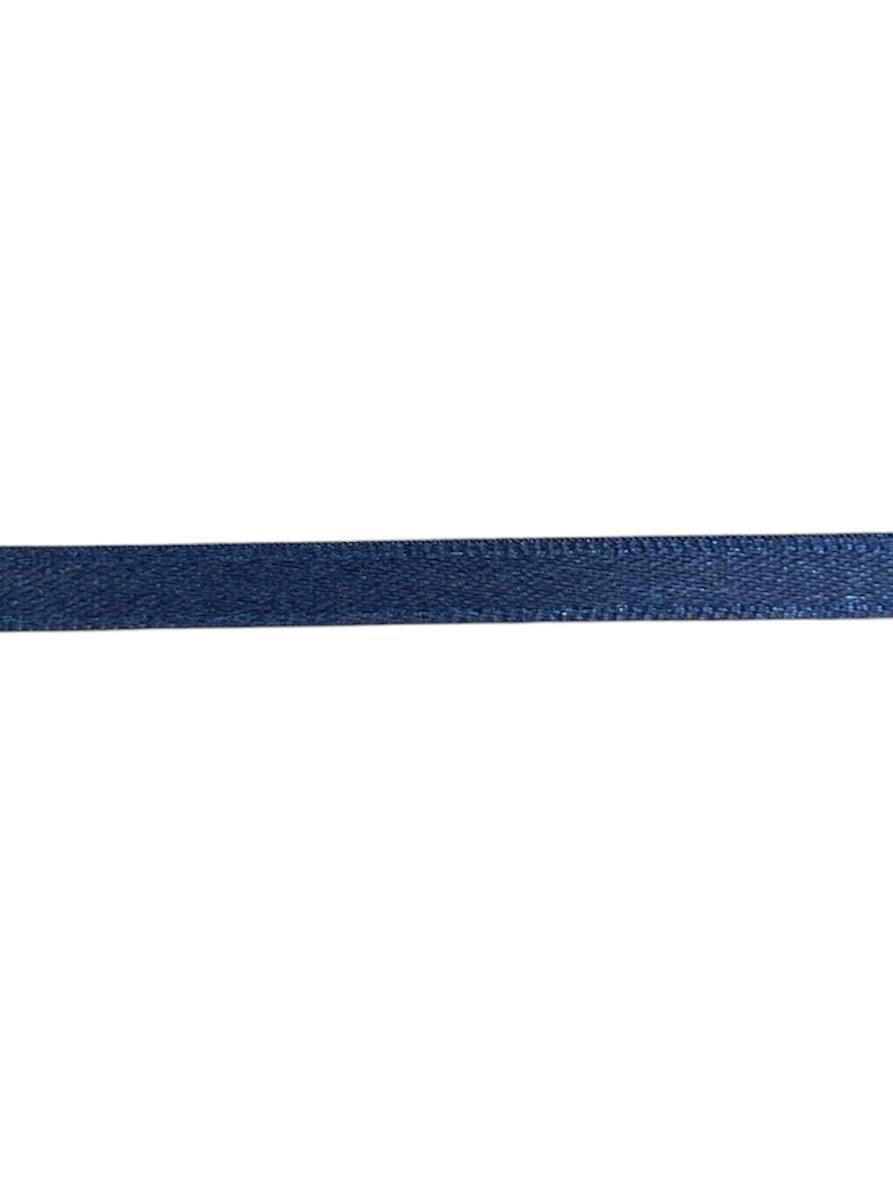 A single roll of 7mm wide navy blue satin ribbon made from polyester fabric.