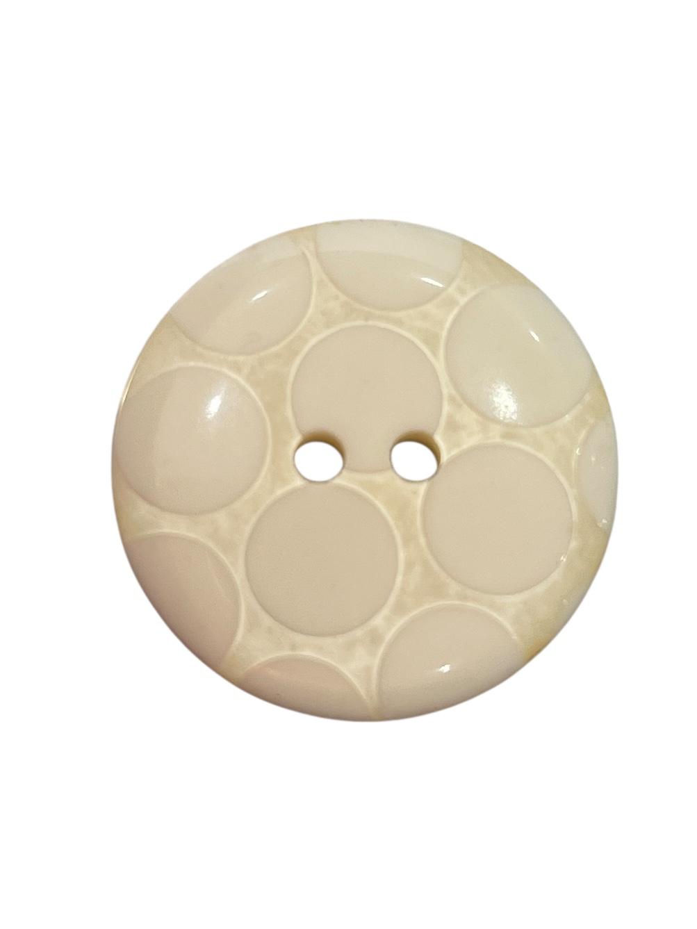 Ivory round 25mm polyester button with a two-hole design and a raised circular spot pattern.
