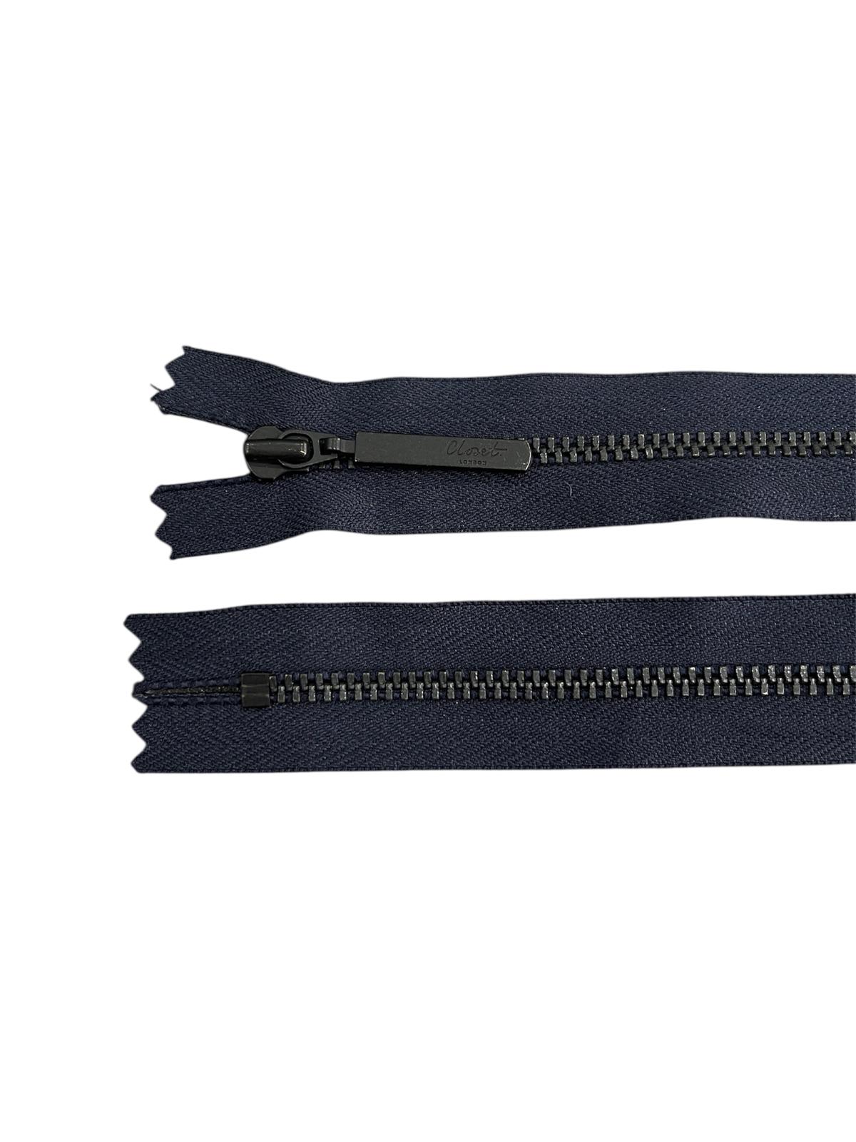 YKK size 3 black metal closed-end zipper with a metal pull tab.