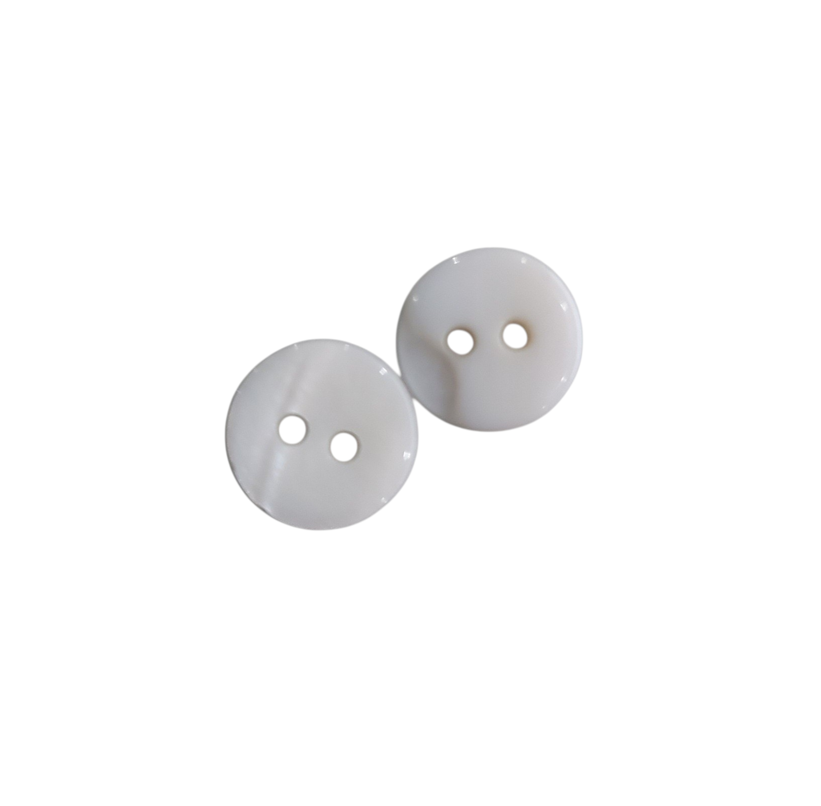 Two small, round white shell buttons with two holes each are shown against a white background.