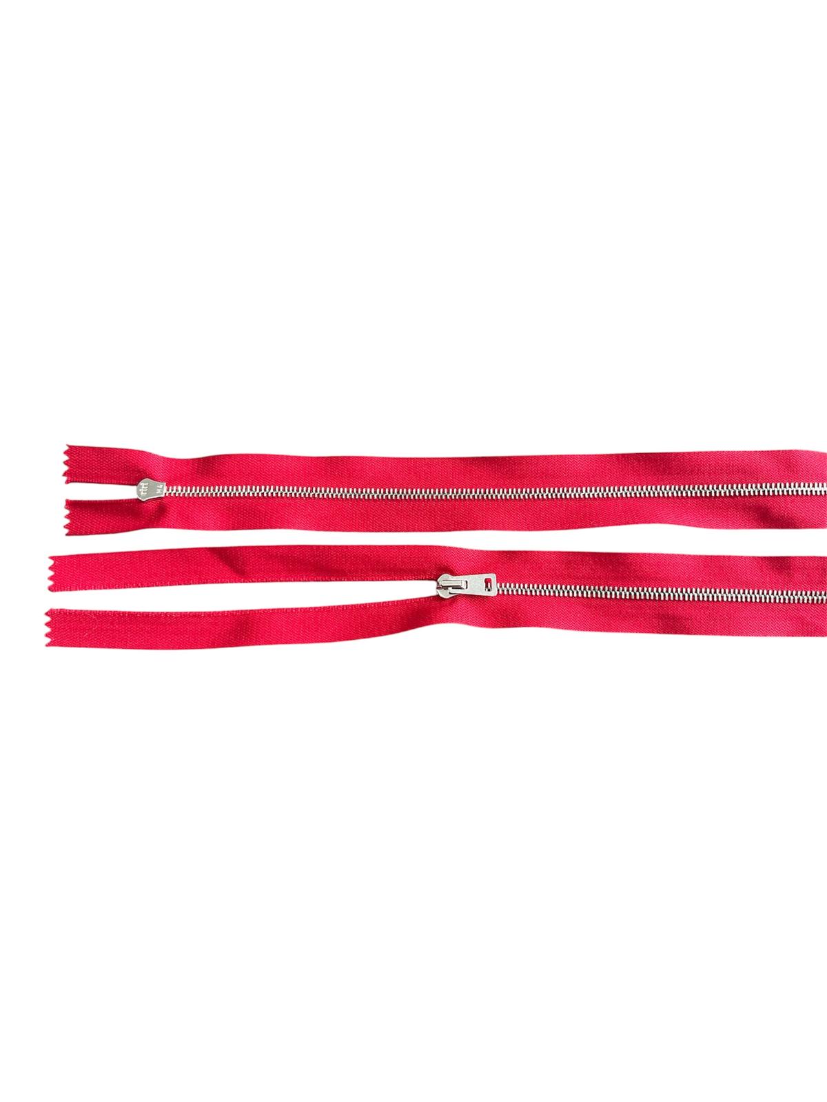 Two red RIRI M4 two-way open metal zippers with silver teeth and sliders on a white background.