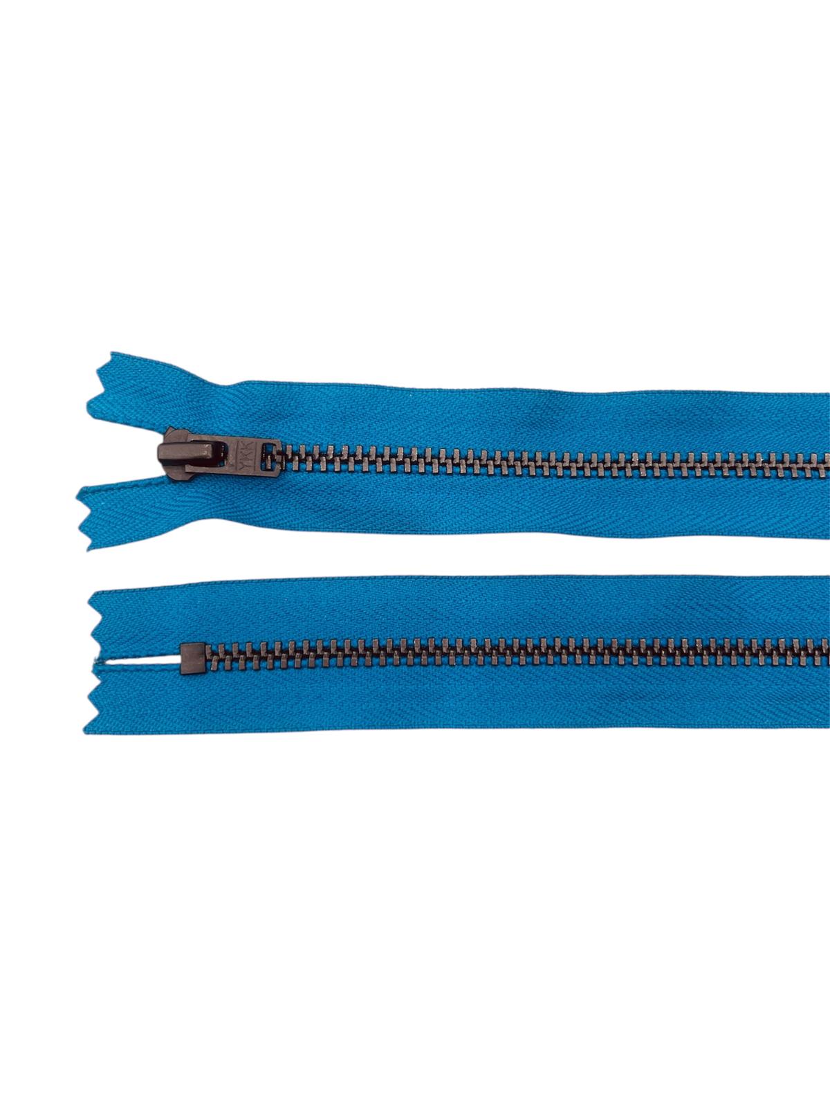Two teal zippers with black metal teeth and sliders on a white background.