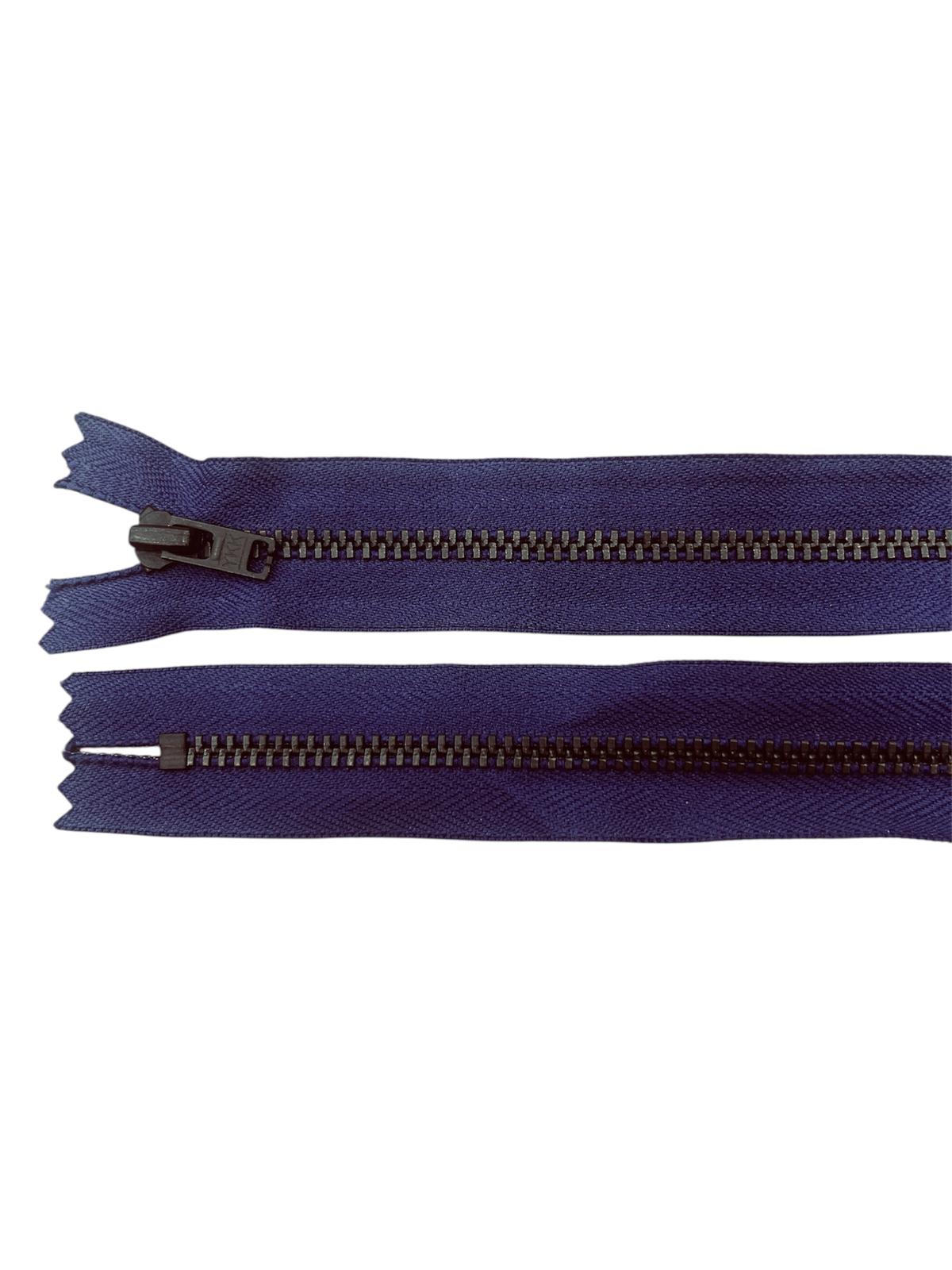 Two navy blue zippers with black metal teeth and sliders on a white background.